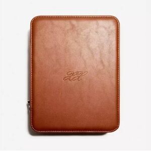 Never before used, chocolate brown Lexxola Jet-Setter Travel Case